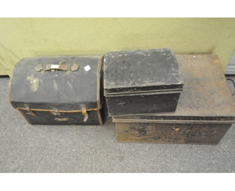 A canvas bound domed trunk with a leather handle, together with a heavily rusted metal strong box