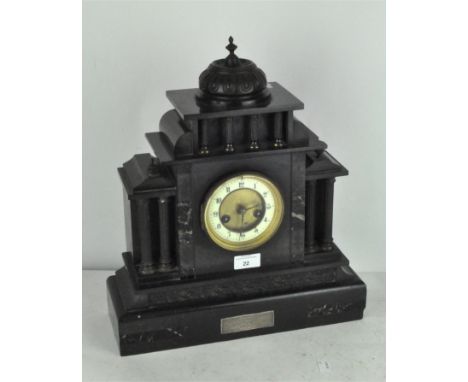 An Edwardian black slate mantel clock with marble inlaid decoration, plaque to front reads "presented to W Slade Esq with bes