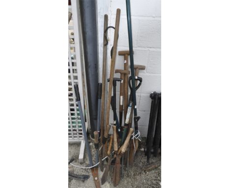 A collection of garden tools, including: shears, spades, cutters and pitch forks 