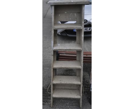 A wooden A frame step ladder, 143 cm high 
