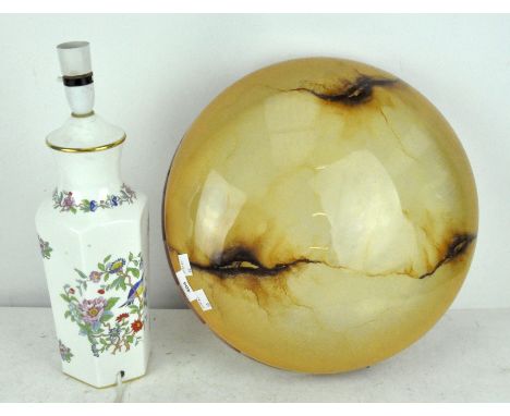 A porcelain lamp decorated with birds and flowers on a white ground, 41 cm high; together with a glass ceiling lamp shade of 