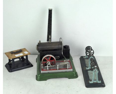 A vintage Fleischmann steam engine and accessories, including a table saw