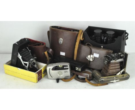 Various vintage cameras, including a Tricho folding camera, Kershaw eight-20 King Penguin and a pair of binoculars
