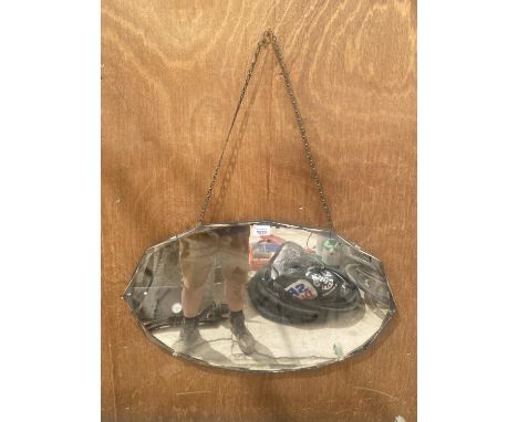 AN ART DECO UNFRAMED BEVELED EDGE MIRROR WITH HANGING CHAIN 