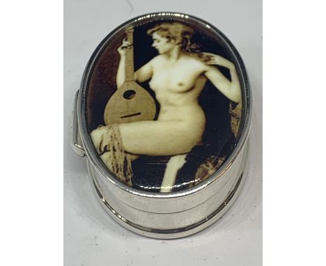 A MARKED SILVER PILL BOX WITH AN ENAMEL EROTIC DESIGN TOP 