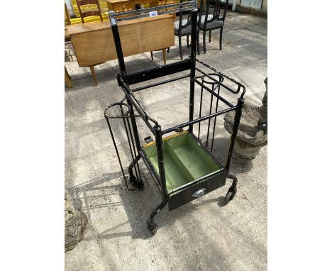 A VINTAGE METAL FOUR WHEELED STORAGE STAND 