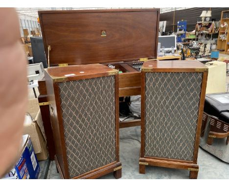 A RETRO STEREO CABINET WITH DYATRON RECORD PLAYER AND A PAIR OF SPEAKERS 