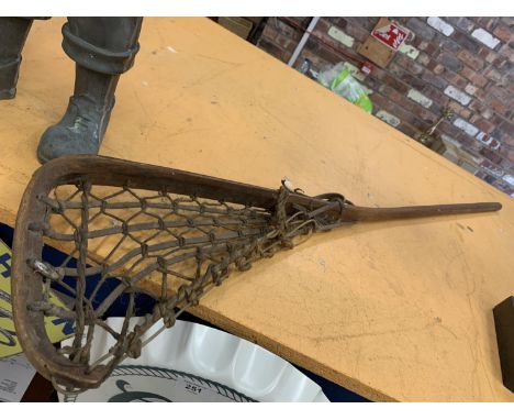 A VINTAGE LACROSSE STICK 