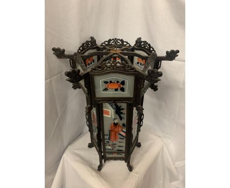 A HIGHLY DECORATIVE HAND PAINTED GLASS ORIENTAL LANTERN WITH CARVED HARDWOOD H 60CM, W 51CM 
