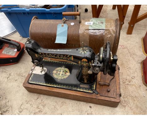 A VINTAGE SINGER SEWING MACHINE WITH WOODEN CARRY CASE 