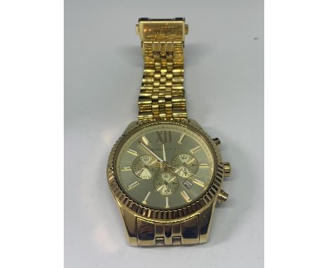 A GILT CHRONOGRAPH FASHION WATCH SEEN WORKING BUT NO WARRANTY 