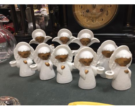 NINE CERAMIC ANGEL CANDLE HOLDERS 