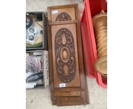 A GROUP OF FOUR VINTAGE AND DECORATIVE CARVED WOODEN PANELS 