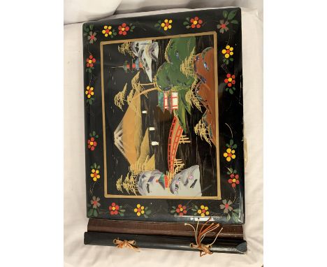 A VINTAGE HANDPAINTED WOODEN PHOTO ALBUM, DEPCITING AN ORIENTAL SCENE WITH MOTHER OF PEARL INLAY 39CM X 27CM 