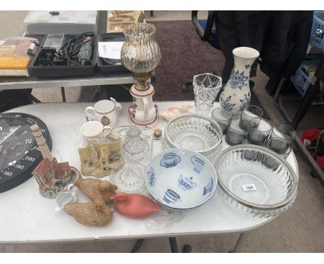 AN ASSORTMENT OF GLASS AND CERAMIC WARE TO INCLUDE VASES, BOWLS AND FIGURES OF HOUSES ETC 