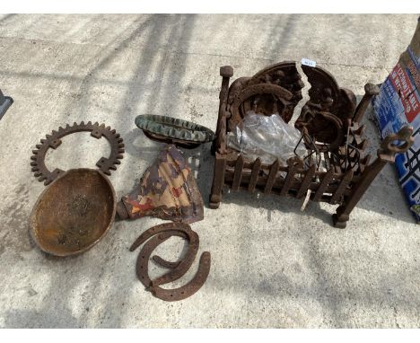 AN ASSORTMENT OF ITEMS TO INCLUDE A CAST IRON FIRE GRATE, COGS AND GUTTER HOPPER ETC 