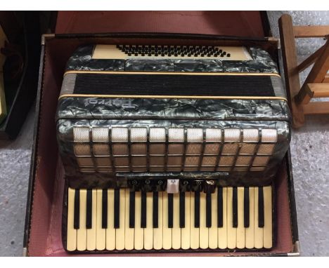 A VINTAGE CASED PARROT ACCORDIAN 