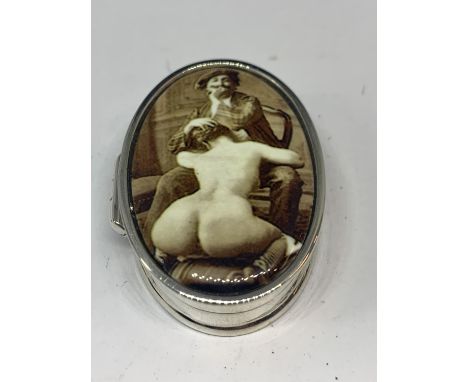 A MARKED SILVER PILL BOX WITH AN EROTIC DESIGN ENAMEL LID 