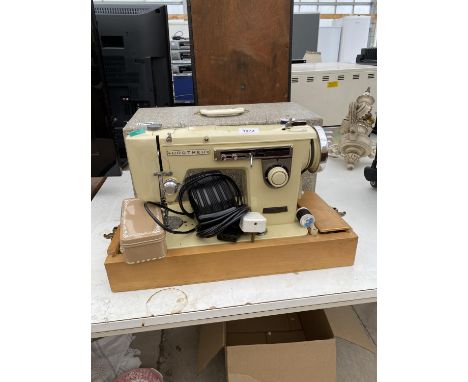 A VINTAGE BROTHER SEWING MACHINE WITH CARRY CASE 