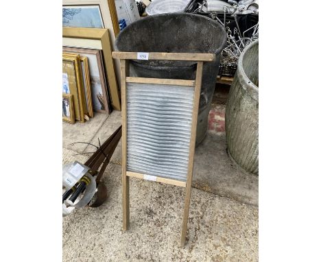 A VINTAGE GALVANISED DUSTBIN AND A WASH BOARD 