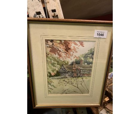 A FRAMED PRINT DEPICTING A TUDOR HOUSE 
