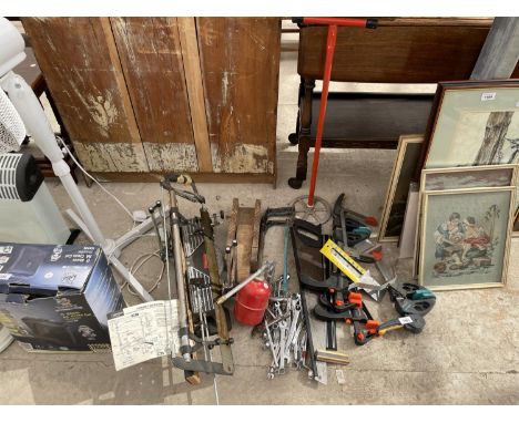 AN ASSORTMENT OF TOOLS TO INCLUDE CLAMPS, A MITRE SAW AND SPANNERS ETC 