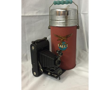 A VINTAGE KODAK CAMERA AND AN EAGLE BRAND VACUUM FLASK 