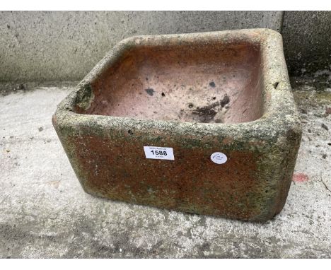 A BROWN SALT GLAZED TROUGH 