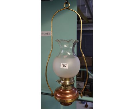 Brass hanging oil lamp with frosted glass baluster shade.(B.P. 24% incl. VAT) 