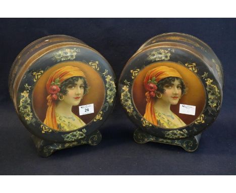 Pair of Japanned metal drum-head-shaped biscuit tins with printed portrait decoration and Art Nouveau design gilded and flora