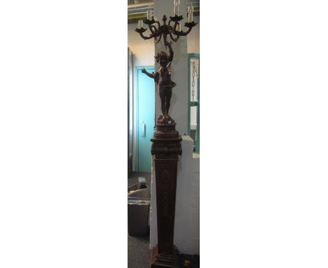 Modern, classical style bronzed figural, six-branch candelabra-type lamp in the form of a standing cherub, on a doric-column-