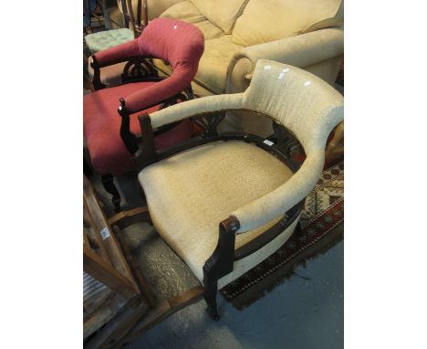 Two similar Edwardian ebonised and upholstered tub chairs on cabriole legs with ceramic casters. (2)(B.P. 21% + VAT) 