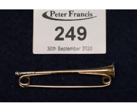 Gold and silver pin brooch in the form of a post horn. Unmarked. 4g approx.(B.P. 21% + VAT) 