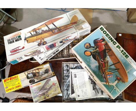 A Boeing P-12E Hasegawa model kit boxed 1/32 scale, A Matchbox DH-82A/C Tiger Moth 1/32 boxed, two smaller kits Keil Kraft an