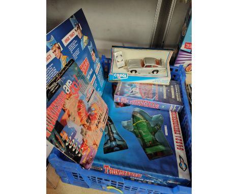 An originally boxed Matchbox Thunderbirds Rescue pack, A Corgi James Bond Aston Martin 94060 diecast vehicle, Star Trek watch