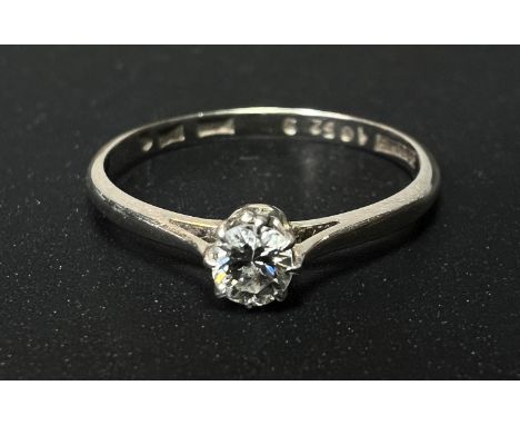 A white metal ring stamped '18ct', set solitaire diamond, stone diameter 3.5mm approx, size 'M', 1.6gm 