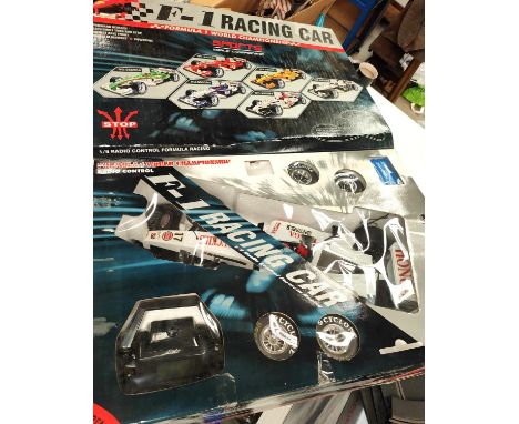 A boxed Radio controlled F-1 racing car by Daied 1:8 scale and a Micro Scalextric Mercedes boxed set 