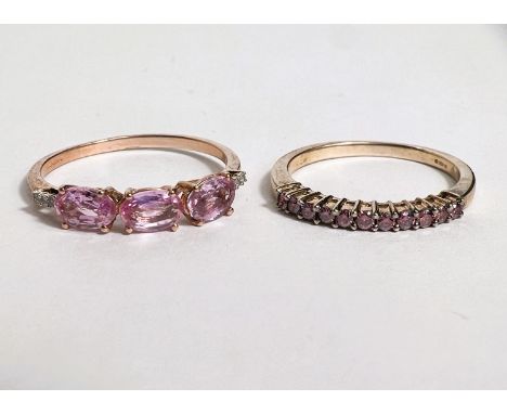 A 9 carat hallmarked gold half eternity style ring set band of pink sapphires, size N;&nbsp;a 9 carat hallmarked gold dress r