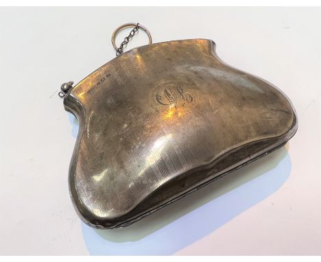 A hallmarked silver engine turned evening purse, monogrammed, Birmingham 1911, 3.5gm; a hallmarked silver compact; a bedside 