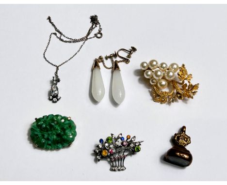 An Edwardian gem set necklace on fine chain; a pair of opaque white drop earrings; a jade coloured brooch; a basket brooch se
