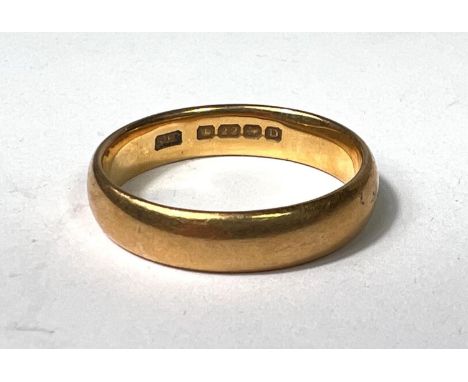 A 22 carat hallmarked gold wedding ring, size O/P, 5.7gm