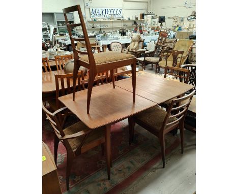 A mid 20th century teak McIntosh extending rectangular dining table on tapering legs, length 146 x height 74cm (extended leng