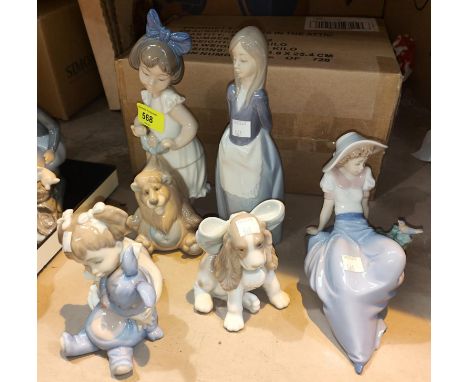 Four Nao figures:&nbsp; reclining girl with bird; girl with toy lion; girl with rabbit &amp; girl in apron; a Nao dog 