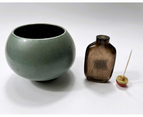 A small Chinese jade coloured bowl on raised foot, 6 character mark to base, diameter 9cm; a Chinese glass snuff bottle incis