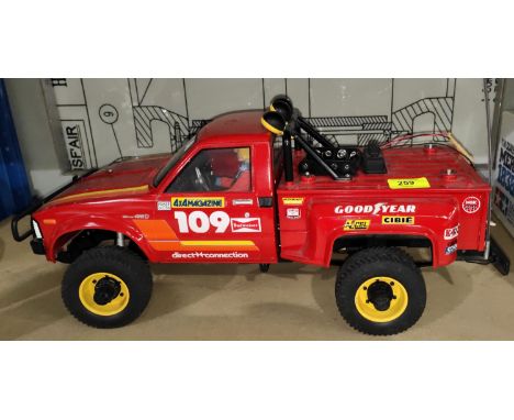 A Tamiya Toyota 4x4 pick up truck 1:10 scale in red&nbsp;(from an estate cannot guarantee working order)&nbsp; 