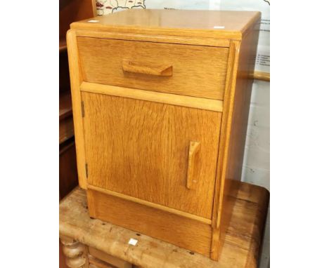 A small mid 20th century light wood G-plan bedside cabinet; A mid 20th century teak nest of 3 tables 