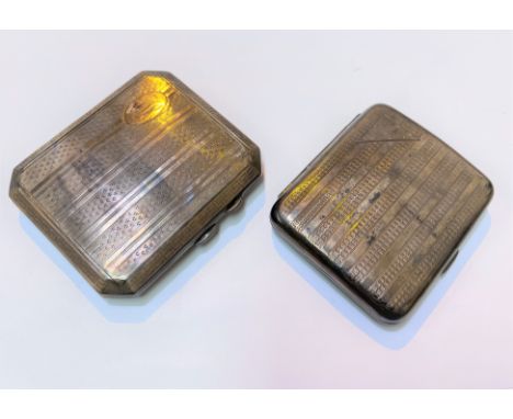 Two hallmarked silver engine turned cigarette cases, Birmingham 1925 &amp; 28 