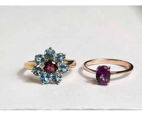 A 9 carat hallmarked gold dress ring with pale blue and pink stones in flowerhead setting, size N;&nbsp;a 9 carat hallmarked 