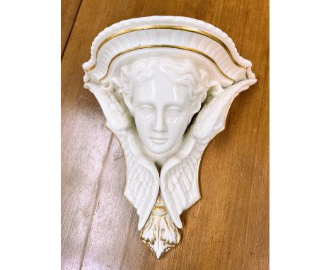 A ceramic cherub head wall bracket 