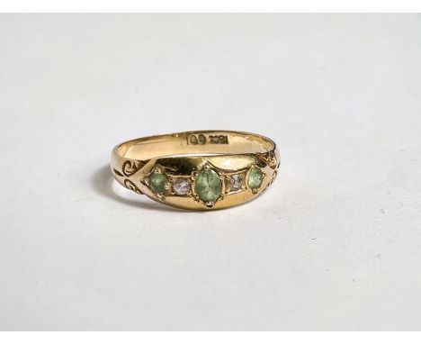 A lady's 18 carat gold dress ring with 3 green tourmalines and 2 diamonds in gypsy style setting, size P; a 9K gold ring with